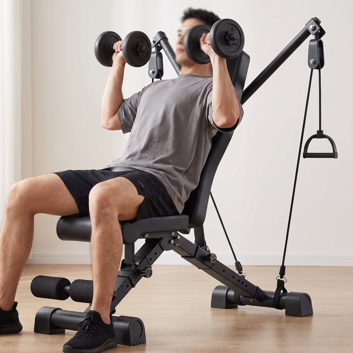 Adjustable weight bench in use - incline dumbbell press at home