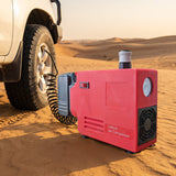 Cordless air compressor inflating a 4x4 tyre on desert sand with air hose connected to the valve