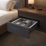 Drawer safe fitted inside a bedside cabinet holding a passport, watch and cash