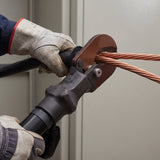 Electric cable cutter in use cutting heavy copper power cable