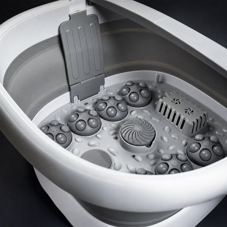 Close up of foot spa basin floor showing massage roller nodes and spiral centre roller
