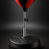 Close up of punching ball spring mount, height adjustment knob and weighted base with filler cap
