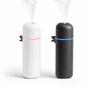 Mini car aroma diffuser in matte white and matte black with glowing LED rings and vent clips, on white background
