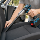 Cordless blower vacuum being used with a crevice nozzle to clean a car seat