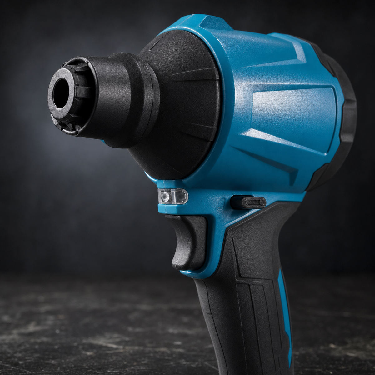 Close up of cordless blower gun air outlet, blue body panel and rubberised grip